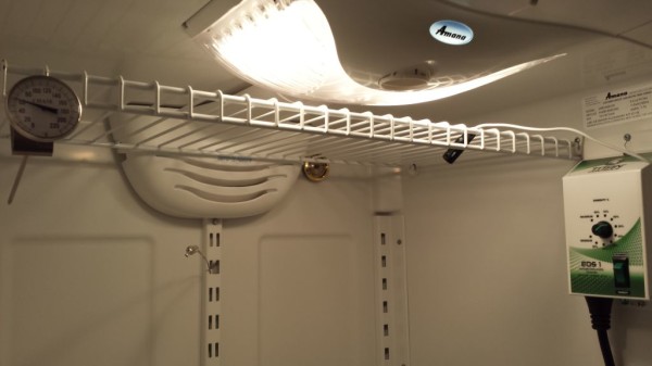 Top rack for hanging meats. Notice the analog hygrometer on the back wall.